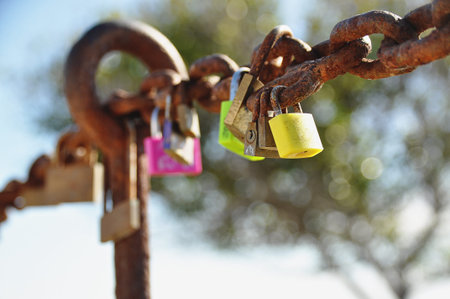 Colorful love locks on rusty chain in Lanzaroteの写真素材