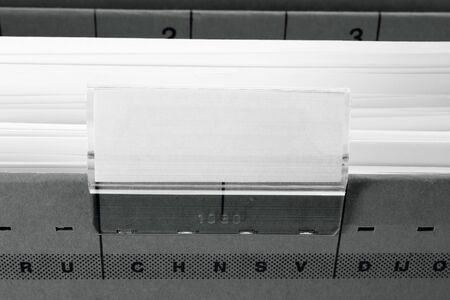 grey hanging file folder with blank label
