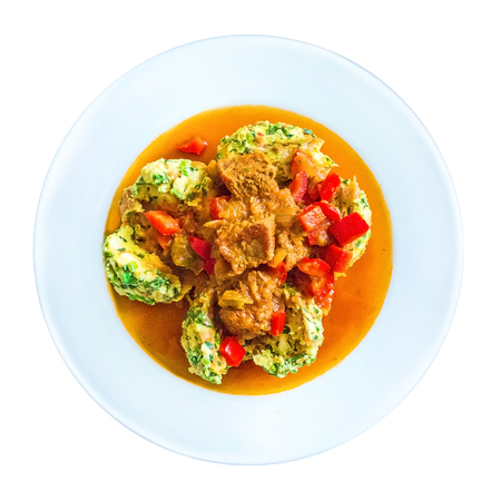 plate with goulash and dumplings isolated on white baclgroundの写真素材