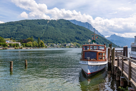 Gmunden, Austria - June 28, 2014: MS J Ruston at jetty of lake Traunsee. The motor boat can carry up to 40 people for sightseeing.のeditorial素材