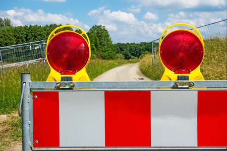 Construction site lamps with beacon on closed streetの写真素材