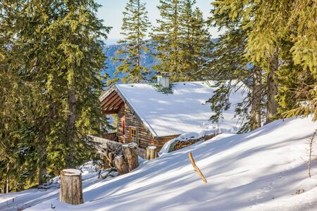 Mountain cabin in the woods - winter landscapeのeditorial素材