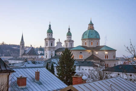 Salzburg, Austria - December 31, 2013: Dome of Salzburg and St. Peter abbey church in the background - after sunsetのeditorial素材
