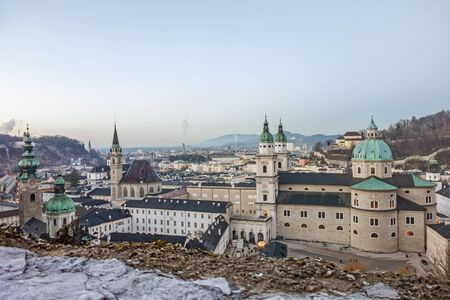 Salzburg, Austria - December 31, 2013: View from Fortress Hohensalzburg to the Kapitelplatz square with Dome of Salzburg, St. Peter abbey church - after sunsetのeditorial素材
