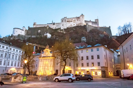 Salzburg, Austria - December 31, 2013: Famous Hohensalzburg Fortress - view from Kapitelplatz square at evening.のeditorial素材