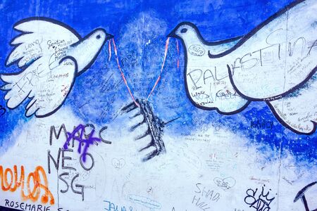 Berlin, Germany - October 26, 2013: East Side Gallery - an international memorial for freedom. Former Berlin Wall - a barrier within Germany, dividing the country.のeditorial素材