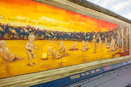 Berlin, Germany - October 26, 2013: East Side Gallery - an international memorial for freedom. Former Berlin Wall - a barrier within Germany, dividing the country.のeditorial素材