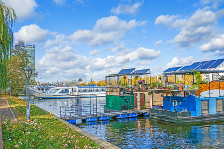 Berlin, Germany - October 29, 2013: River spree in the district  Treptow. House boats and swimming gardens riverside.のeditorial素材