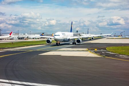 Frankfurt, Germany - May 30, 2013: Runway with several Lufthansa airplanes waiting for clearance to take off.  The Frankfurt International Airport is the largest in Germany and the third largest in Europe.のeditorial素材