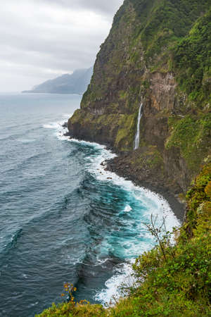 Wild atlantic coast, Island Madeira coastline - impressiv mountain with waterfall - Ponta do Poisoの写真素材