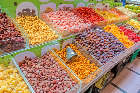 Funchal, Portugal - June 3, 2013: Market booth in Funchal, Madeira with different dried fruits. The market hall in Funchal is a popular tourist destination.のeditorial素材