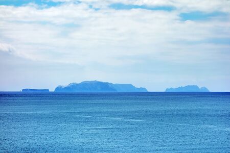 Islands (Ilhas Desertas) in the east of Madeira, from left to right named Chao, Deserta Grande, and Bugio - view from town Canicalの写真素材