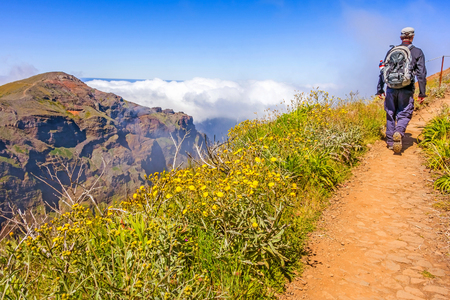 Hiker on a walk - mountain range on the Island of Madeira - mountainous nature landscapeの写真素材