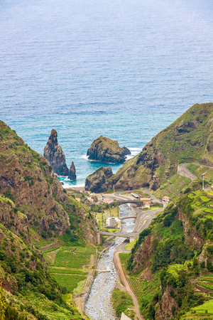 View from the hiking trail Levada do Central da Ribeira da Janela to the Atlantic Ocean, north coast of Madeiraの写真素材