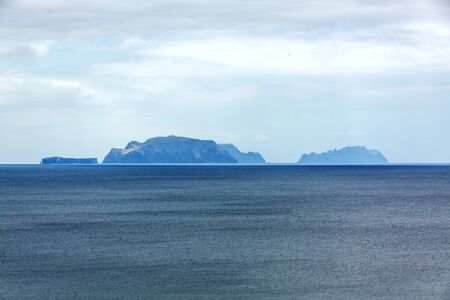 Islands (Ilhas Desertas) in the east of Madeira, from left to right named Chao, Deserta Grande, and Bugio - view from town Canicalの写真素材