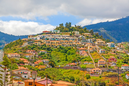 Funchal, Madeira - June 7, 2013: Residential houses of Funchal, the capital city of Madeira - view from Pico dos Barcelo.のeditorial素材