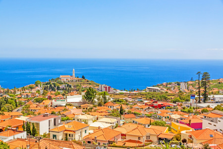 Funchal, Madeira - June 7, 2013: South coast of Funchal -view over the capital city of Madeira, district Sao Martinho with civila parish church. View from Pico dos Barcelo - Atlantic Ocean in the background.のeditorial素材