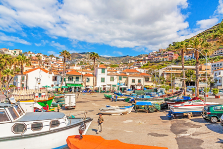 Camara de Lobos, Madeira - June 8, 2013: Port with fishing boats. The village is typical for its cat shark drying under the sun.のeditorial素材