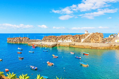 Camara de Lobos, Madeira - June 8, 2013: Port with fishing boats. The village is typical for its cat shark drying under the sun.のeditorial素材