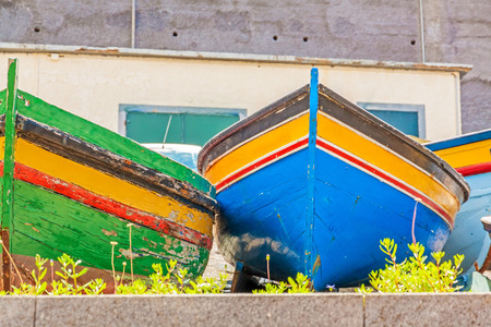 Colorful old fishing boats at landの写真素材