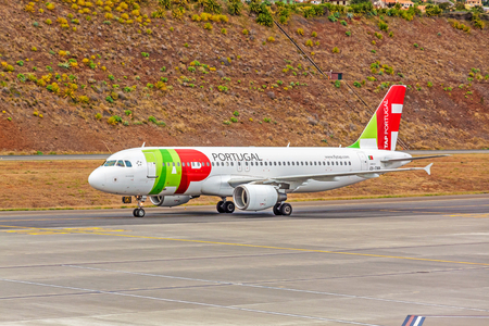 Funchal, Madeira, Portugal - May 30, 2013: At the airport of Madeira (Aeroporto Madeira) - an airplane Airbus A320 from TAP Portugal Airline on runway.のeditorial素材
