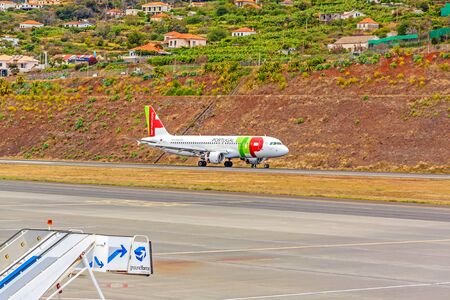 Funchal, Madeira, Portugal - May 30, 2013: At the airport of Madeira (Aeroporto Madeira) - an airplane Airbus A320 from TAP Portugal Airline has landed.のeditorial素材