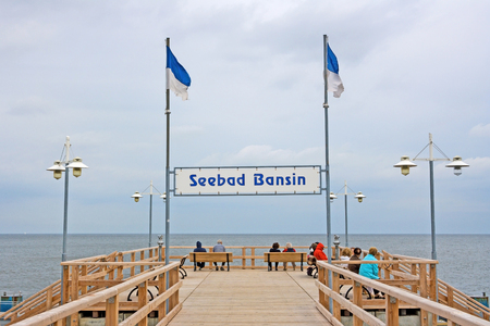 Bansin, Usedom, Germany - June 27, 2012: Pier of the baltic sea spa town Bansin - a famous tourist hotspot. Pier sign labeled with sea spa town Bansin (Seebad Bansin).のeditorial素材