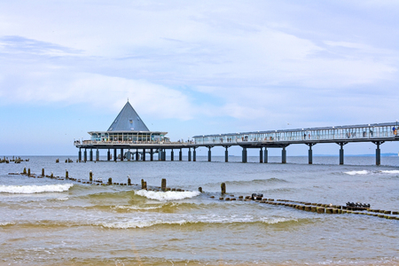 Heringsdorf, Usedom, Germany - June 27, 2012: Famous pier with restaurant building at its end. A tourist hotspot at the beach / baltic sea.のeditorial素材