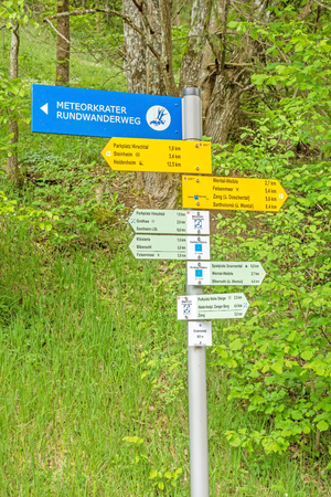 Steinheim, Wental, Germany - May 26, 2016: Wental valley signpost showing path of meteorite crater circular walk (Meteorkrater Rundwanderweg), Swabian Alps (Schwaebische Alp)のeditorial素材