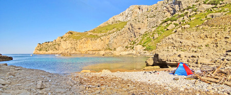 Bay Cala Figuera panorama, Majorca, Spain - rocky beach with beach shelter - impressive mountain cliff in the backgroundの写真素材