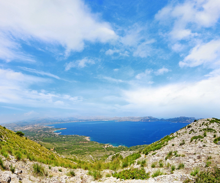 Bay / coast panorama with cloudy sky - mountains in front - north of majorca, spainの写真素材