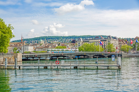Zurich, Switzerland - June 10, 2017: Zurich Quaibrucke bridge with tram, river Limmat / Lake Zurichsee - view from quare Burkliterrasse towards Bellevueplatz squareのeditorial素材