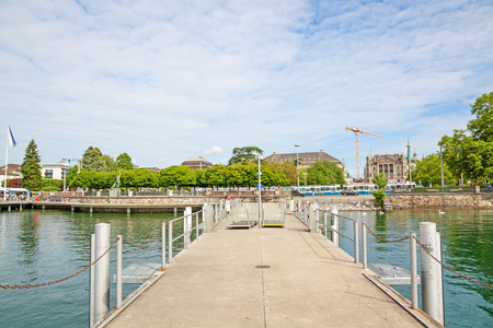 Zurich, Switzerland - June 10, 2017: Shipping pier at Burkliplatz, where excursion ships starts for boat trips over Lake Zurich and river Limmat. View towards inner city of Zuerich.のeditorial素材
