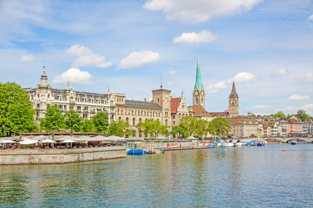 Panorama of historical part of Zurich with famous Fraumunster and St. Peter church on a beautiful summer day, Switzerlandの写真素材