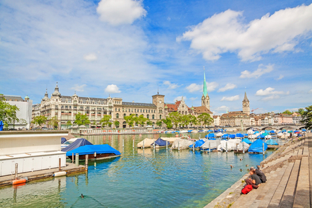 Panorama of historical part of Zurich with famous Fraumunster and St. Peter church on a beautiful summer day, Switzerlandの写真素材