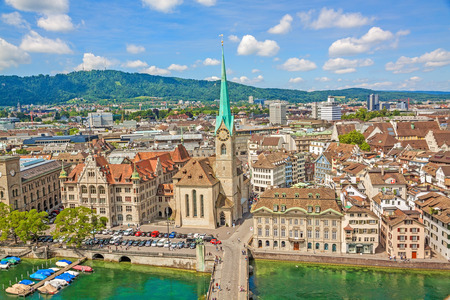 Aerial view of historic Zurich city center with famous Fraumunster Church and river Limmat at Lake Zurich from Grossmunster Church on a sunny day with clouds in summer, Canton of Zurich, Switzerlandのeditorial素材