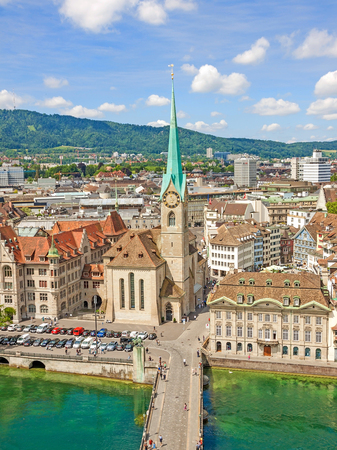 Aerial view of historic Zurich city center with famous Fraumunster Church and river Limmat at Lake Zurich from Grossmunster Church on a sunny day with clouds in summer, Canton of Zurich, Switzerlandのeditorial素材
