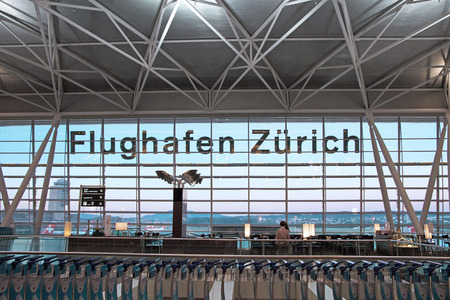 Zurich, Switzerland - June 11, 2017: Airport Zurich (Flughafen Zurich) waiting area after check-in - view towards airfield with letteringのeditorial素材