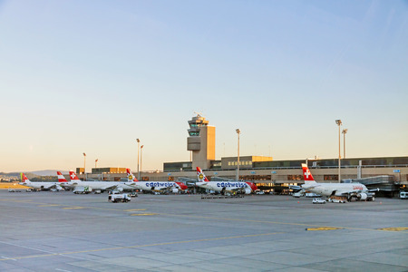 Zurich, Switzerland - June 11, 2017: Airport Zurich (Flughafen Zurich) - view of Tower and airfield with several airbus of airline "edelweiss" in parking positionのeditorial素材
