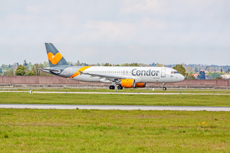Stuttgart, Germany - April 29, 2017: Airbus airplane A320 from Condor at ground (airport Stuttgart) before take off - green meadow with fence in frontのeditorial素材