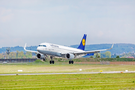 Stuttgart, Germany - April 29, 2017: Airbus airplane A320 200 from Lufthansa on landing approach to airport Stuttgart - runway and green meadow in frontのeditorial素材