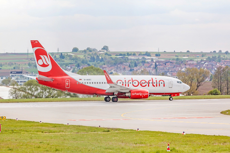 Stuttgart, Germany - April 29, 2017: Boeing airplane 737 from Air Berlin at ground (airport Stuttgart) before takeoff - runway and green meadow in frontのeditorial素材