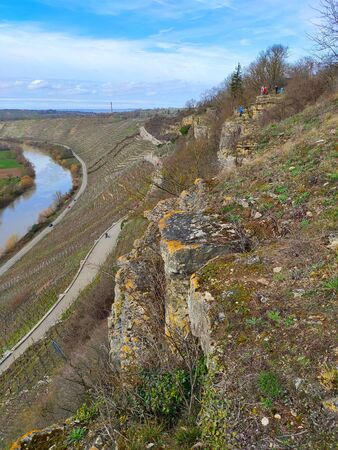 Path through vineyards near rocks of the Hessigheimer Felsengaerten with river Neckar in backgroundの写真素材