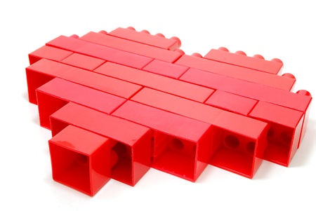 Single Red Heart made of Lego Blocks Laying Isolated on Whiteの写真素材