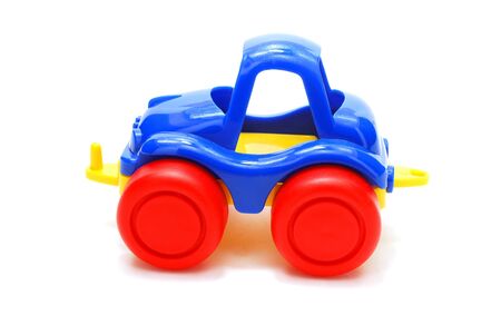 Tiny Blue Car Toy with Red Wheels Isolated on Whiteの写真素材