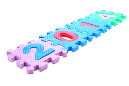 Text 2014 Made of Children Puzzle Parts Isolated on Whiteの写真素材