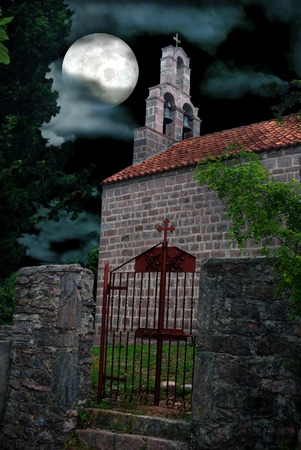 Gothic Chapel Graveyard on Full Moon Dramatic Sky Backgoundの写真素材