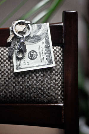 keys and money on a chairの写真素材