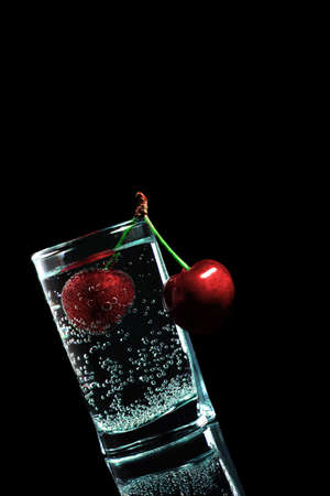 A glass with a cherryの写真素材