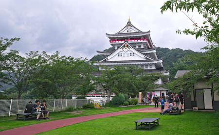 Atami, Shizuoka / Japan - July 24 2020: Visitors relax on the grounds near Atami Castle on an overcast day in summerのeditorial素材